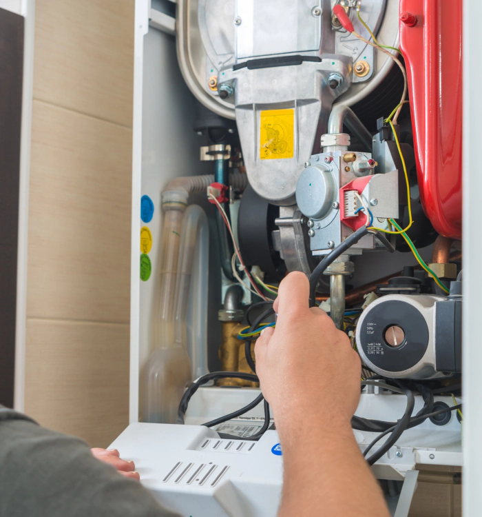 A technician diagnosing a furnace and explaining the fix